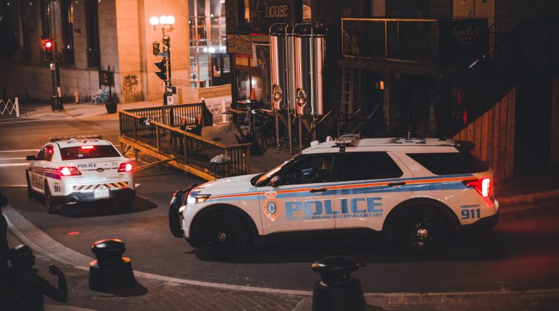 police car patrol city street