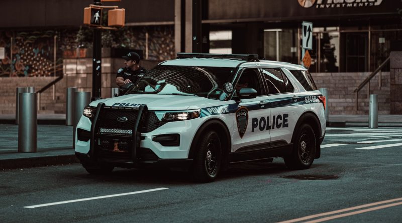 police car patrol city street