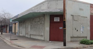 A boarded-up vacant commercial property in Fresno's Tower District