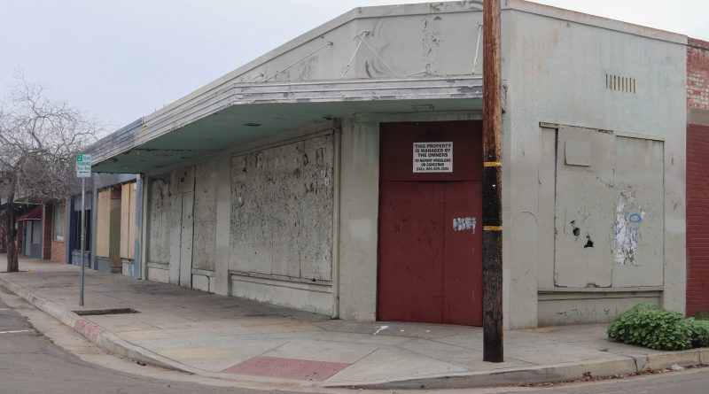 A boarded-up vacant commercial property in Fresno's Tower District