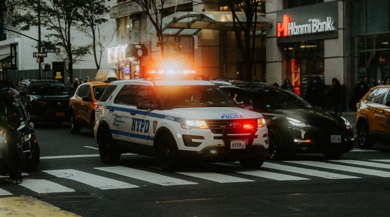 police car patrol city street