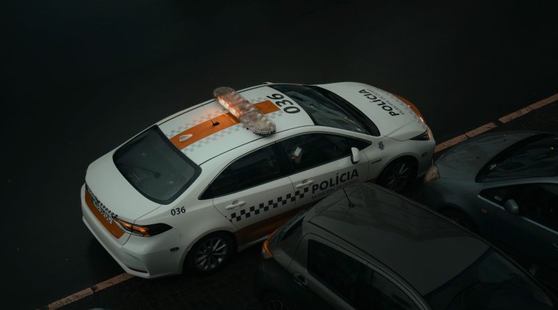 police car patrol city street