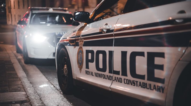 police car patrol city street